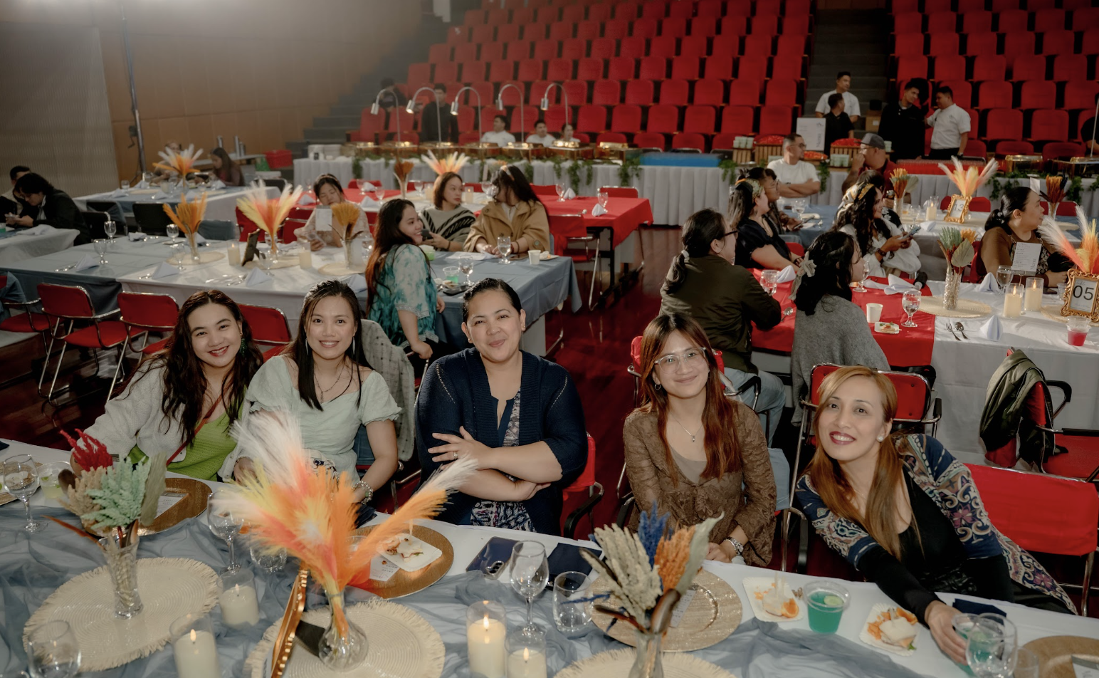 REassist employees celebrating at their tables during the 11th anniversary event