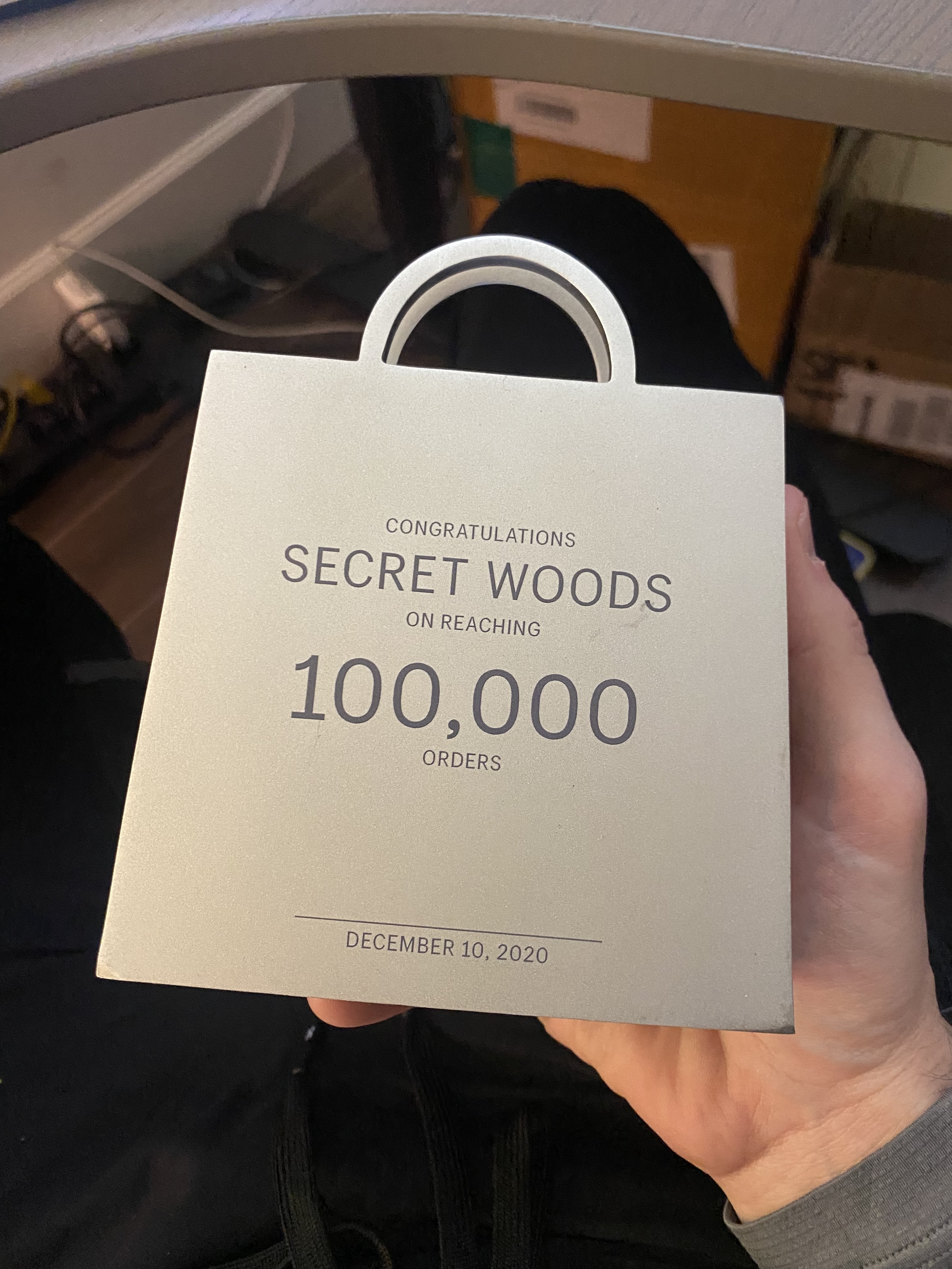 Secret Woods jewelry display with dark premium styling