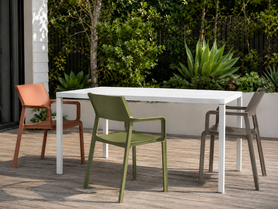 Bold colourful Nardi outdoor chairs arranged on a sunny Australian alfresco