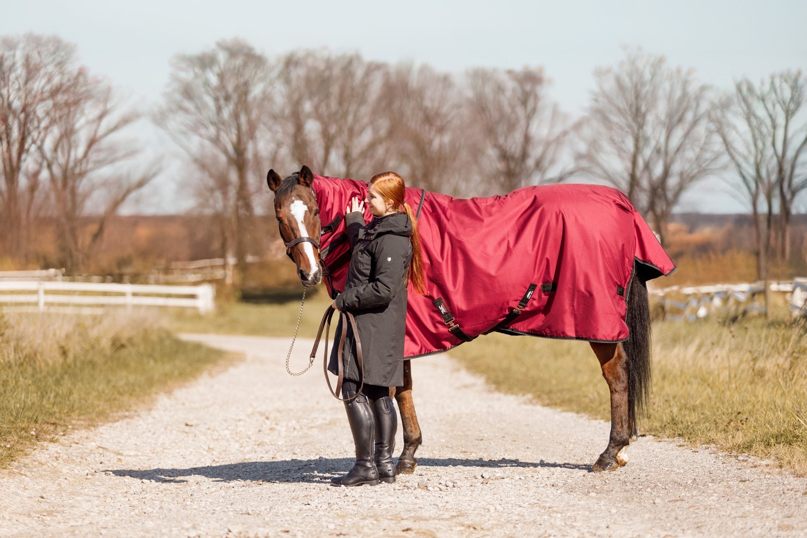 A horse and handler checking blanket fit