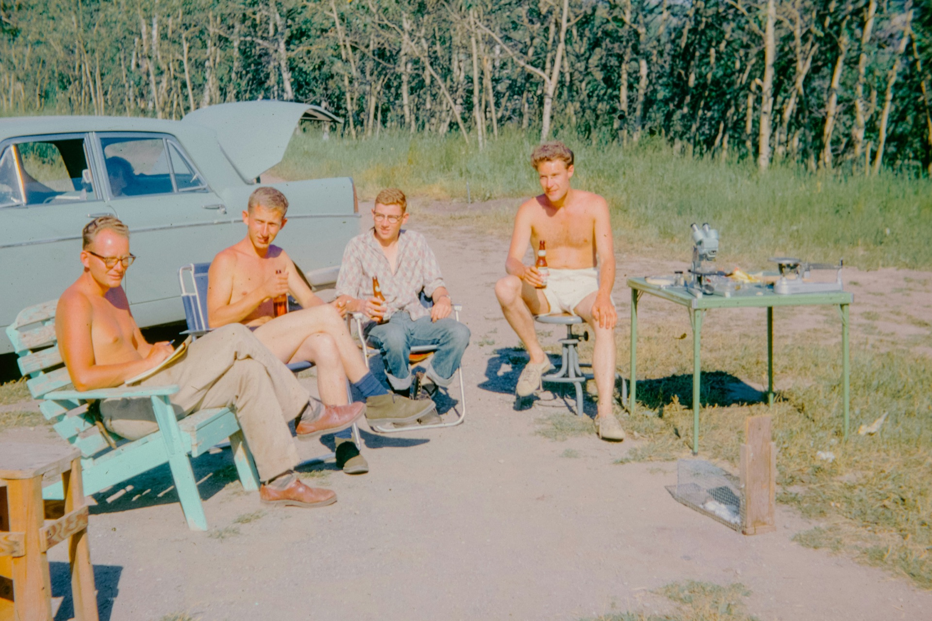 A few dads relaxing at camp, sometime last century