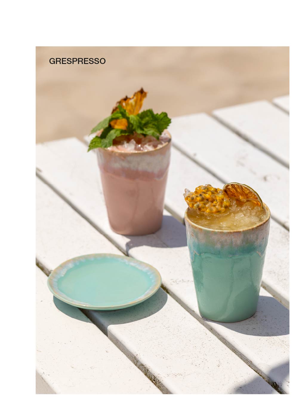 Block of four photographs, Grespresso tumblers with drinks in pink and green tones on a white wooden table with an Arenito plate, Arenito bowl in light blue and beige with fresh figs cut in half, Dori bowl in blue and white with a marbled effect, and Eivissa set with bowl, plates and oval platter in light blue and beige on a wooden table