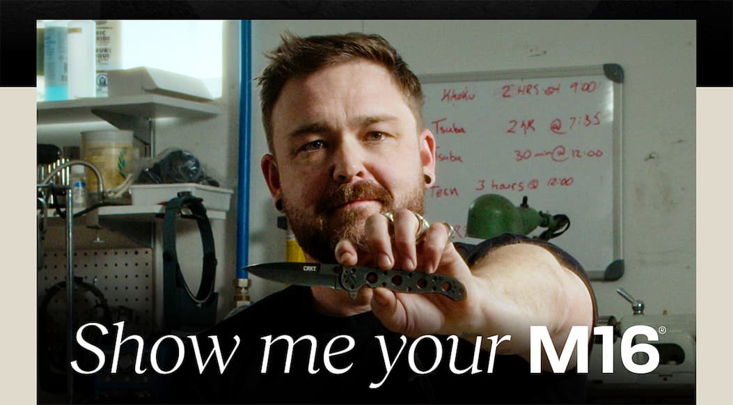 Man holding m16 knife in a confident pose