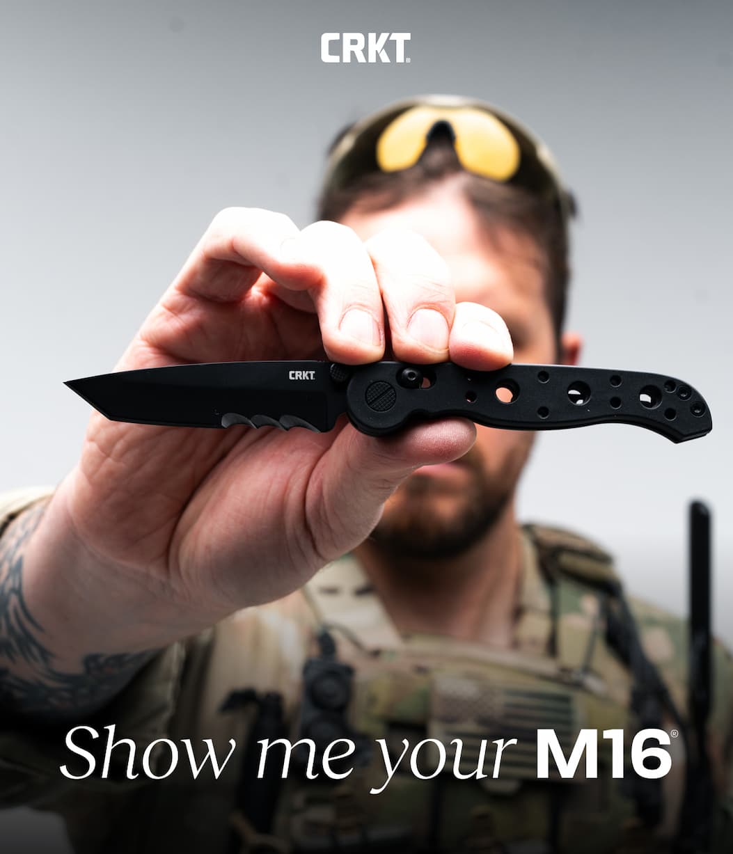 Man holding m16 knife in a confident pose