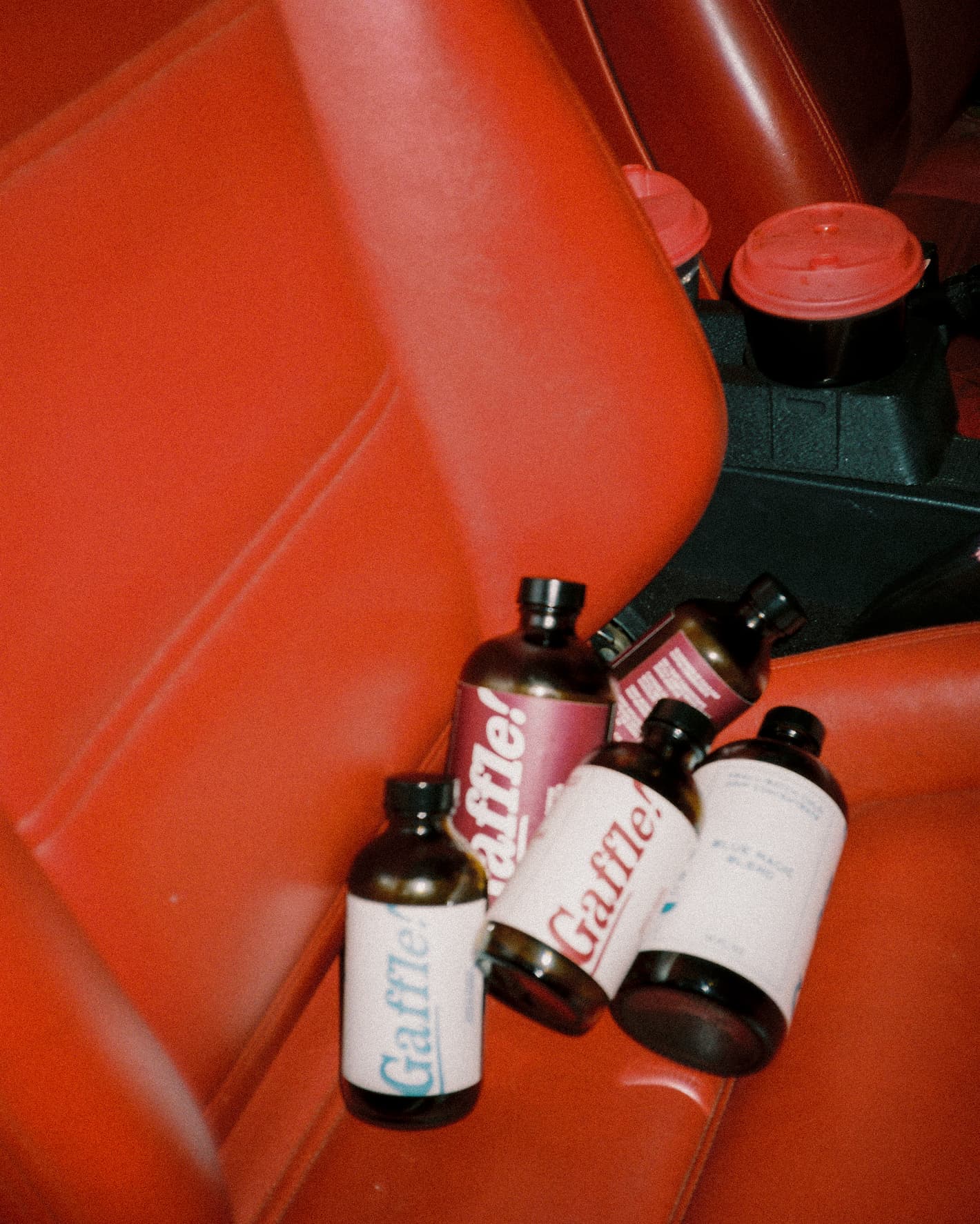 Gaffle cold drip bottles on red film