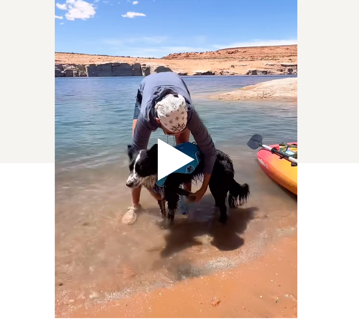 A man helps his pupperoo put on a Confluence Life Jacket at Antelope Canyon.