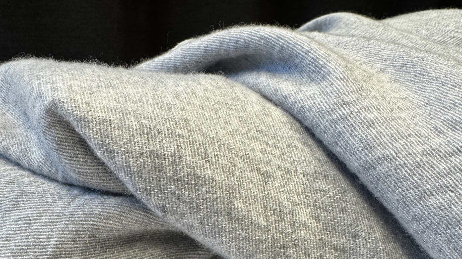 The soft texture and drape of an Eco Cashmere bedspread