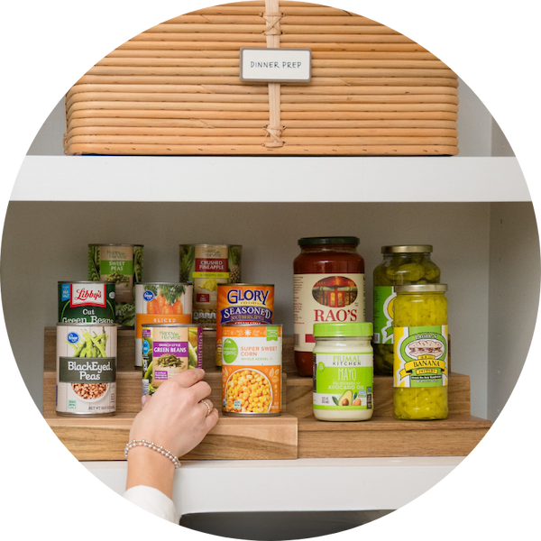 An acacia riser holding canned goods