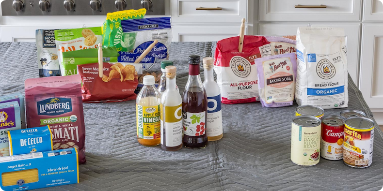 Pantry products sorted on a table top.