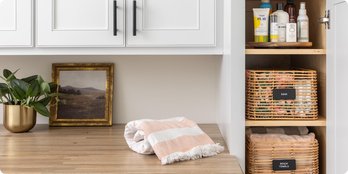 Swimwear and outdoor supplies organized in a mudroom