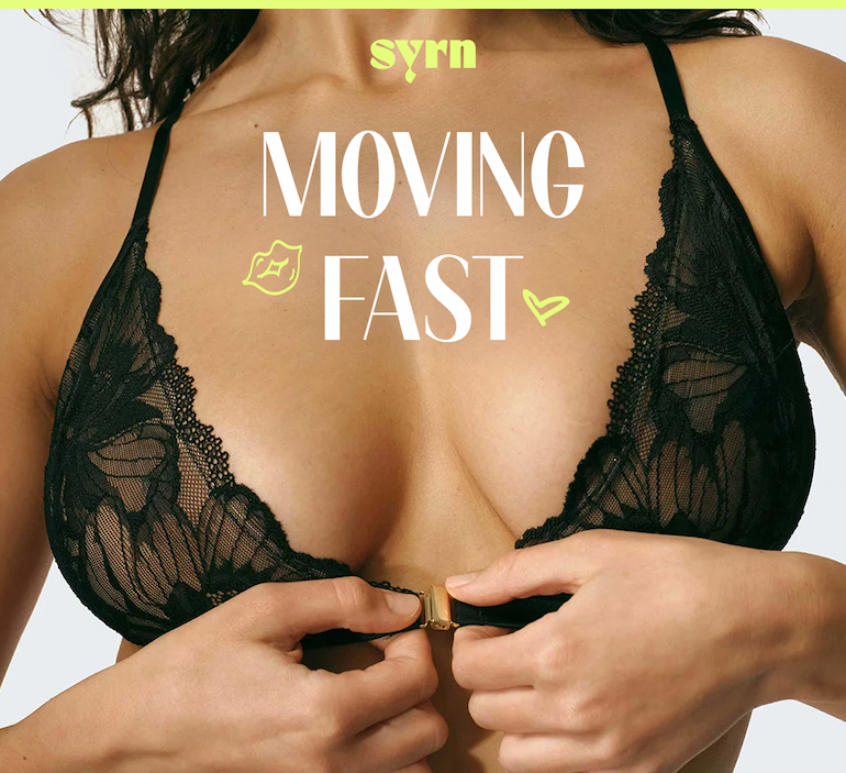 Photo of a woman clasping a bra over her boobs