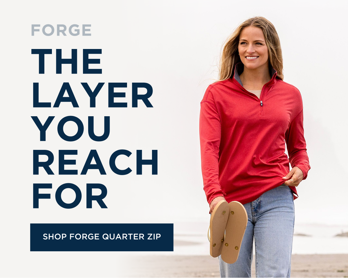 Woman wearing Forge Quarter Zip on the beach | Shop Forge Quarter Zip