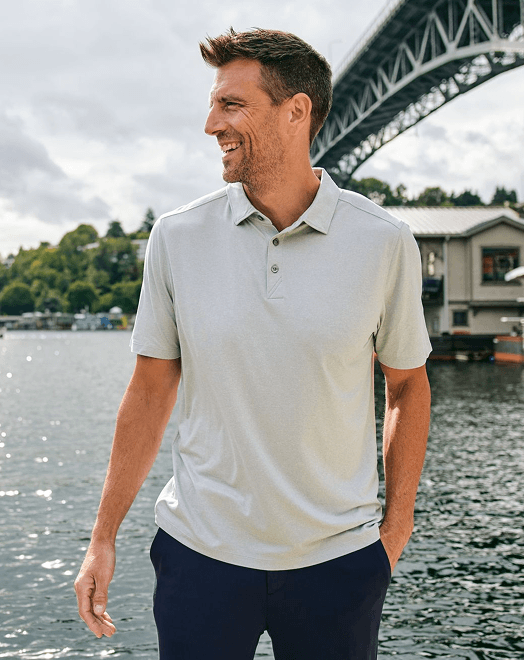 Man with Polo near water