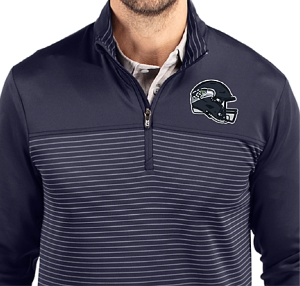 Man wearing a Traverse quarter zip with NFL helmet logo