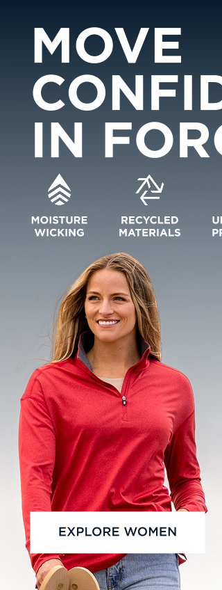 Woman walking on the beach and wearing a red quarter zip | Explore Women