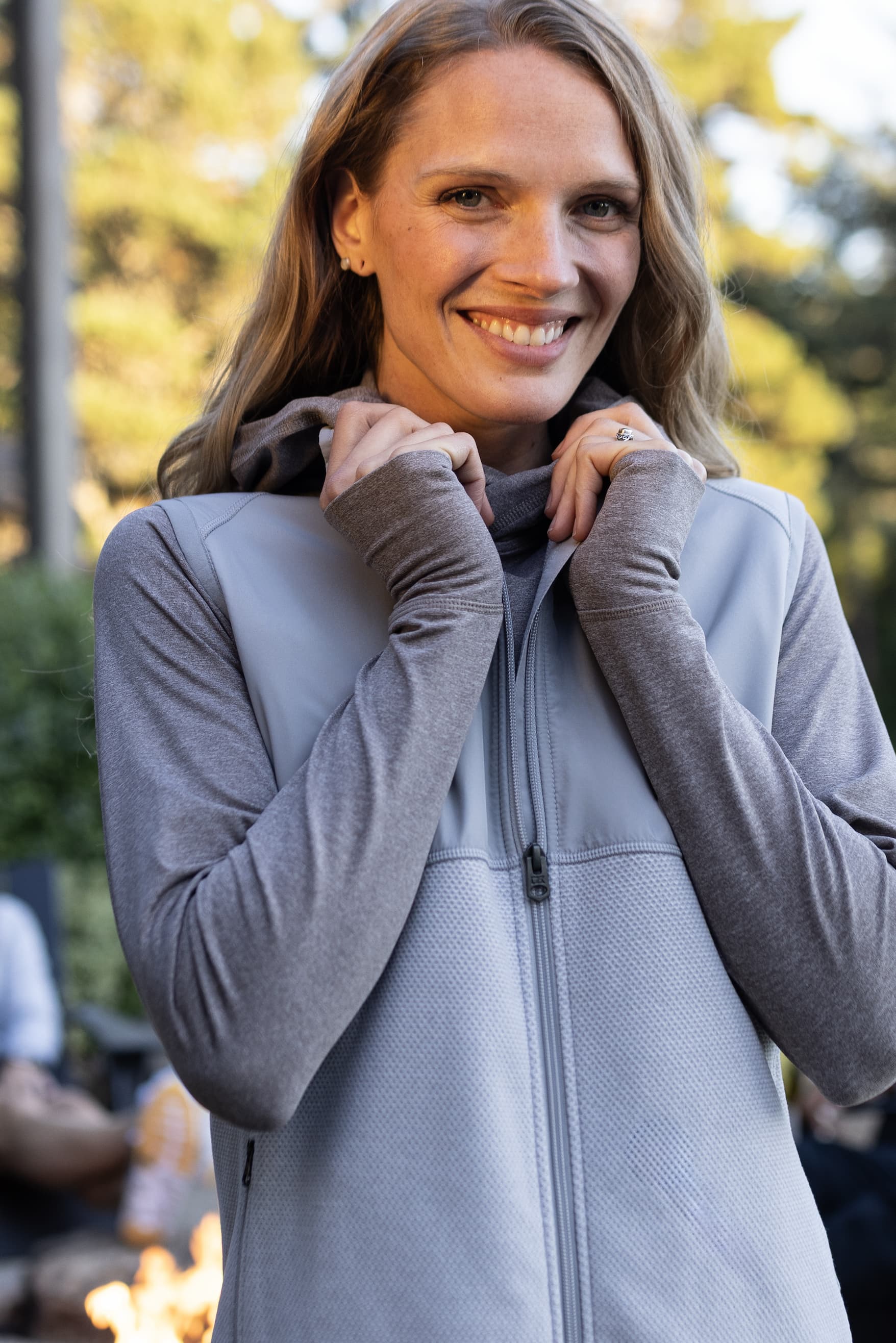 Woman wearing Hunts Point recycled fleece full zip vest in polished color | Shop Now