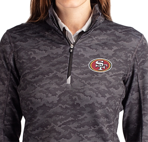 Woman wearing a Traverse Quarter Zip with logo