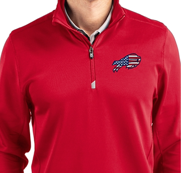 Man wearing Traverse quarter zip with Americana logo