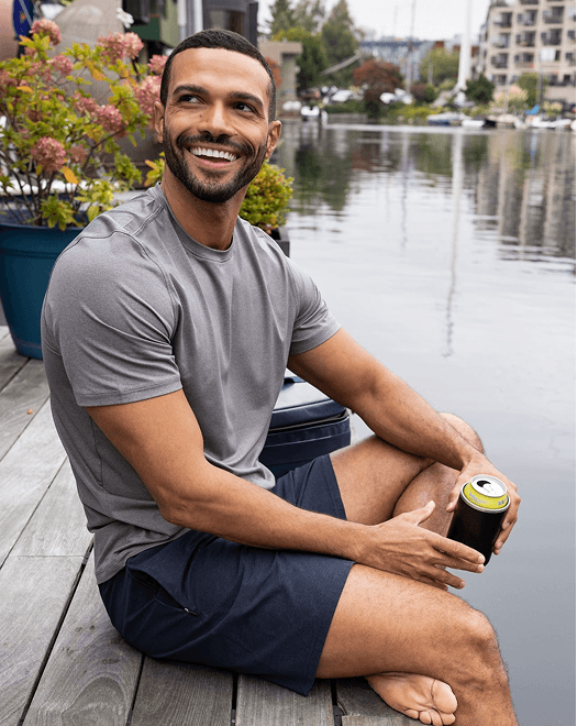 Man wearing Tee near water