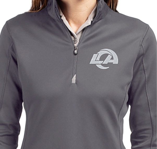 Woman wearing a Traverse quarter zip with Mono logo