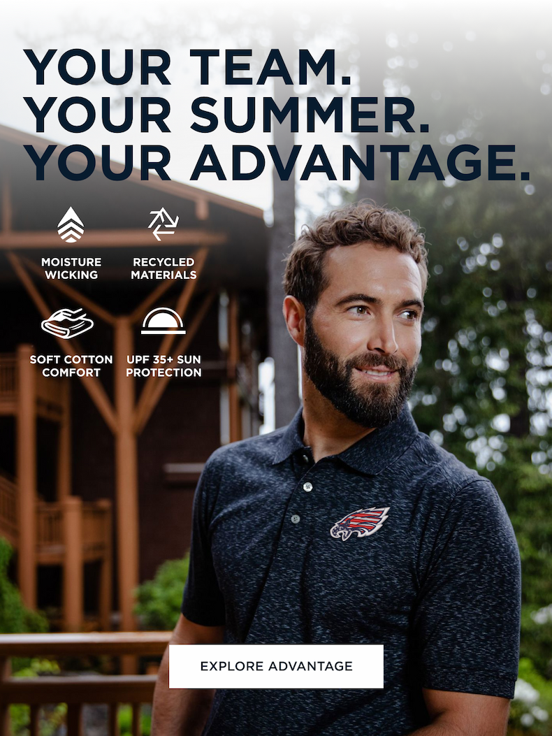 Man wearing an Advantage polo outside of a cabin | Explore Advantage