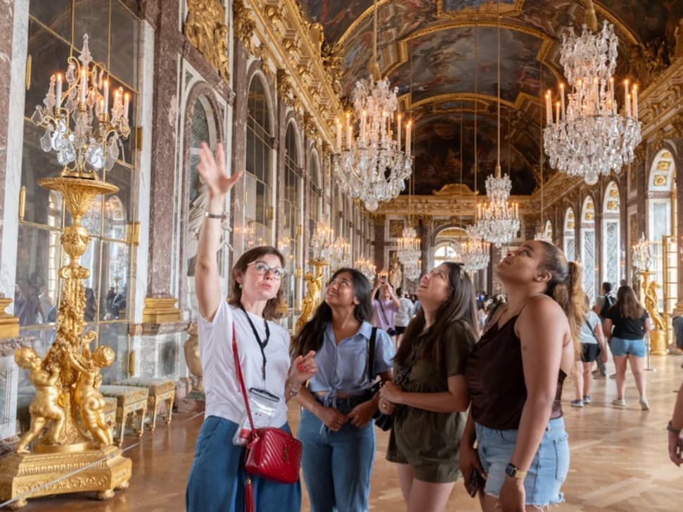Tour guide inside Palace of Versailles