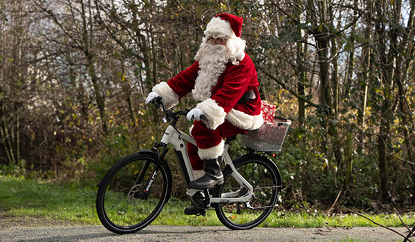 Santa riding an OHM e-bike