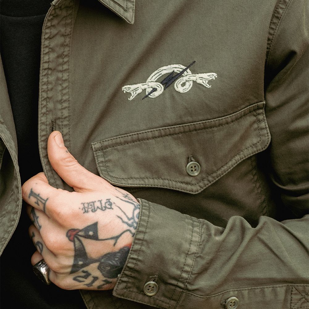 A gif showing various apparel items from Mutt, including some brown leather gloves, a khaki overshirt with a snake & bolt embroidered design and a black hoodie with a skull graphic.