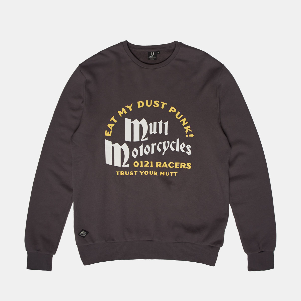 A flatlay photograph of the grey sweatshirt the model is wearing saying "Eat my dust punk!"
