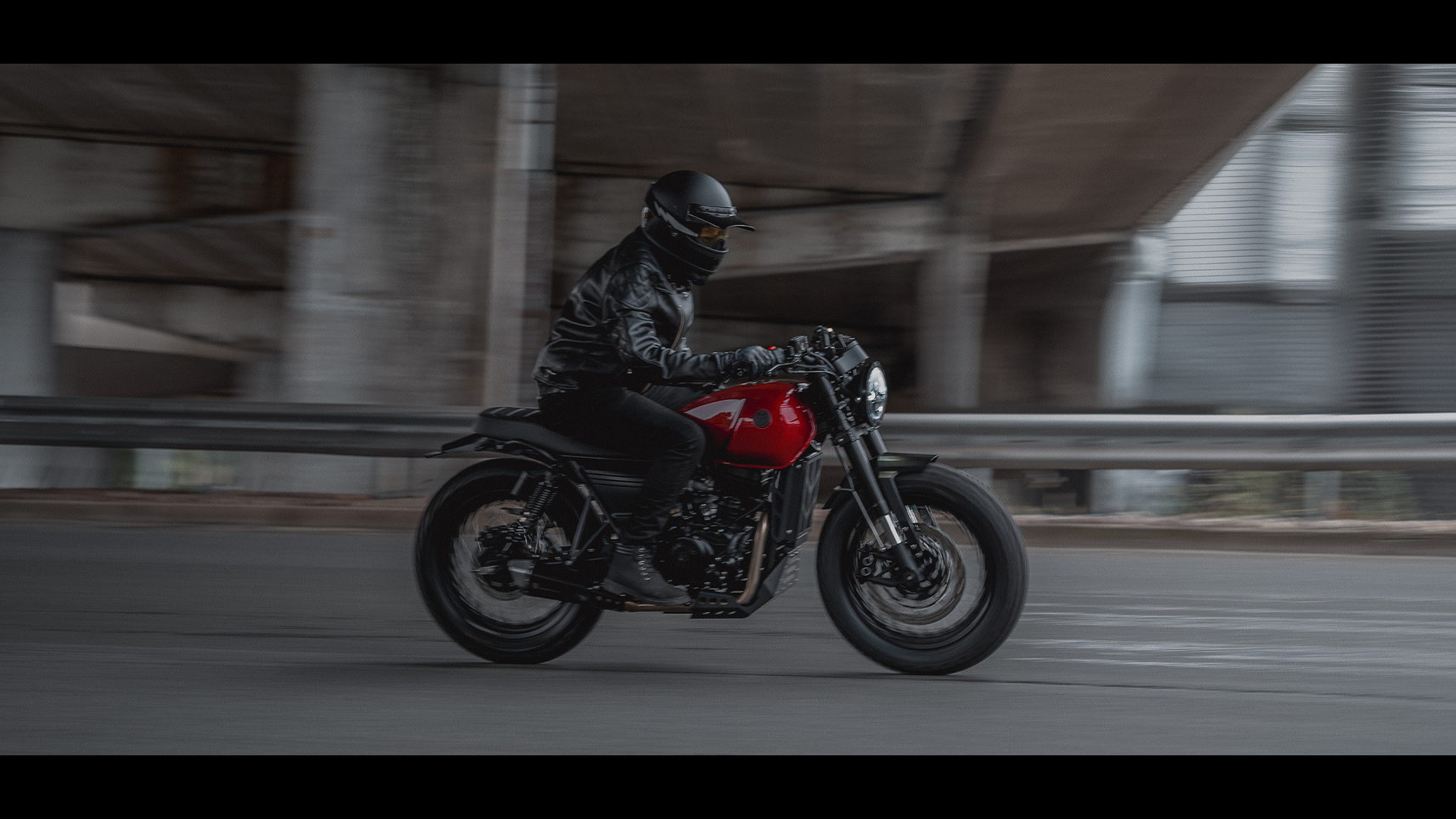 The new DRK-01 in Candy Red complete with rider storms through a ringroad