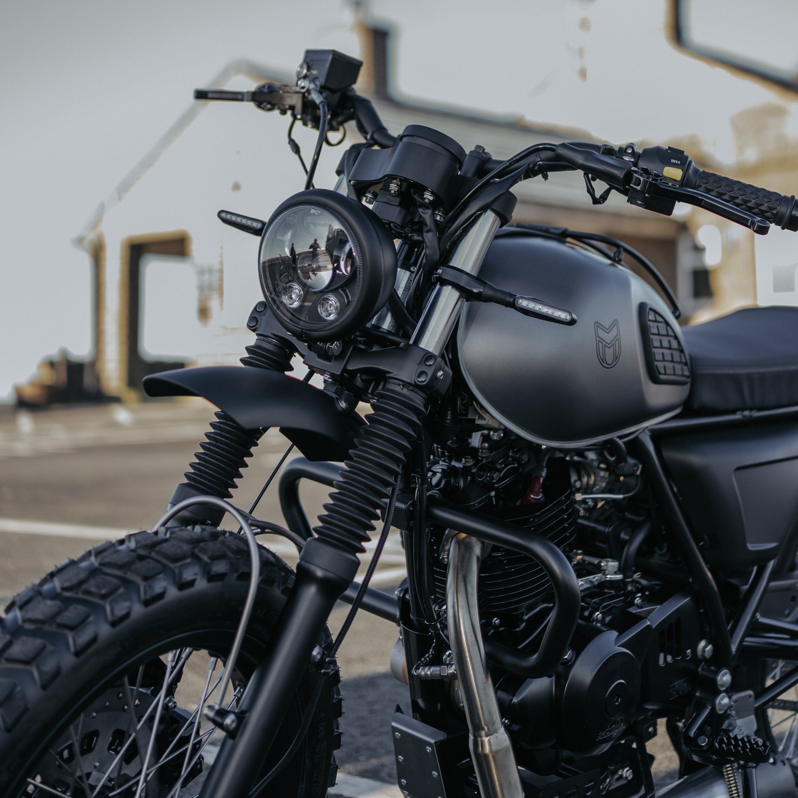 A photo of our titanium grey Mushman bike, with the focus on the front end of the bike.