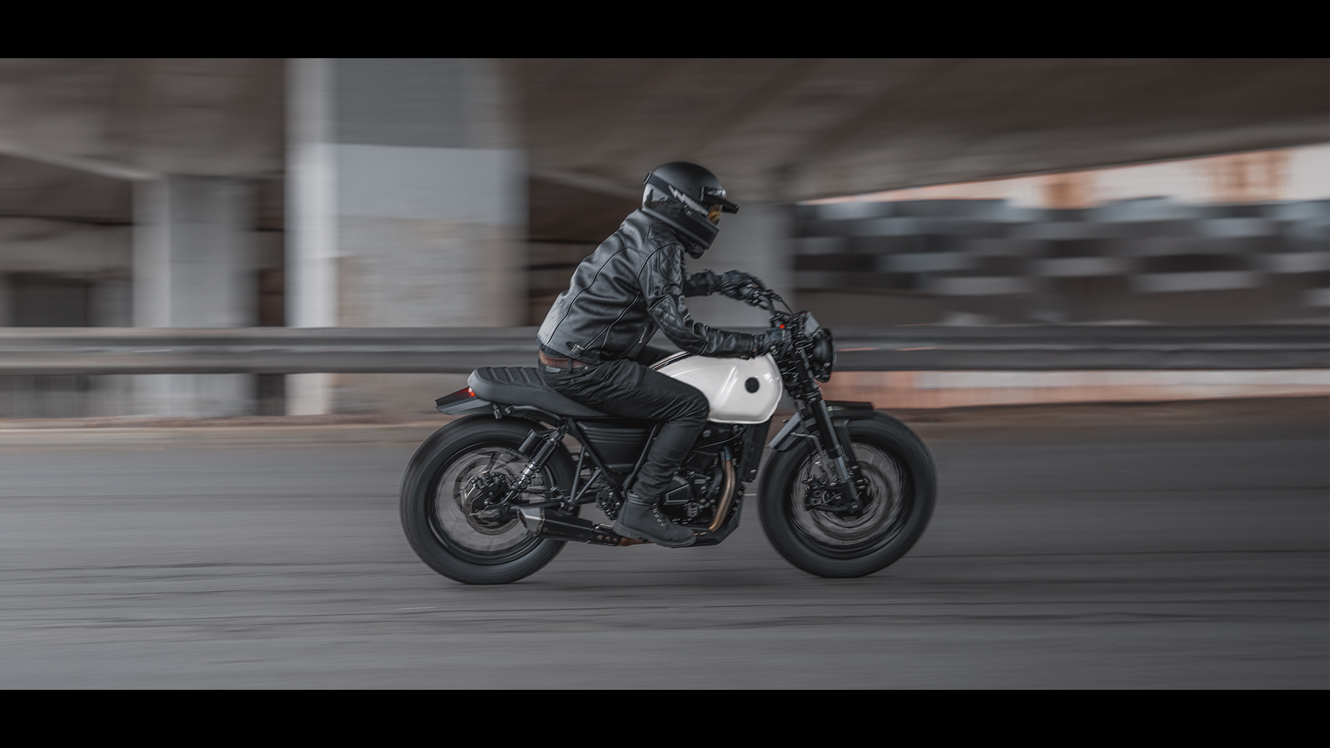 The new DRK-01 in White Sand complete with rider blasts round a ringroad