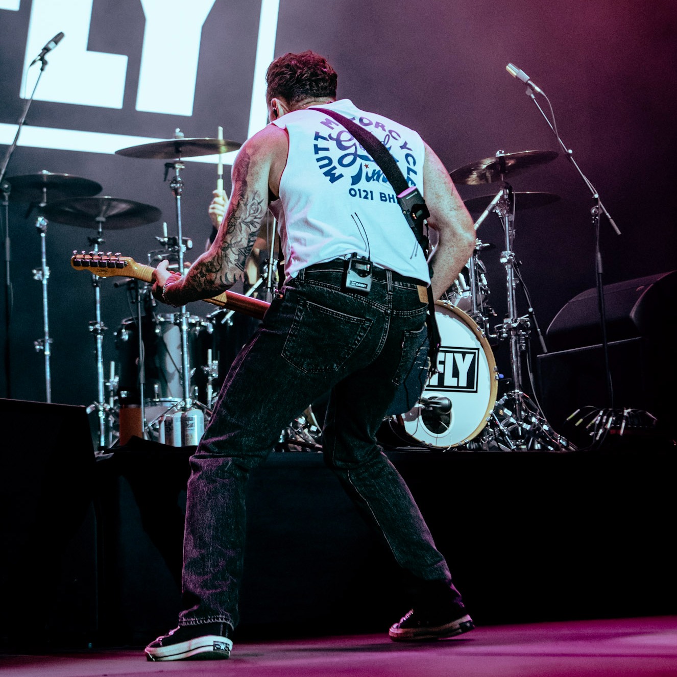 Danny Jones of McFly with his back to the camera showing off the Mutt Motorcycles GT tee
