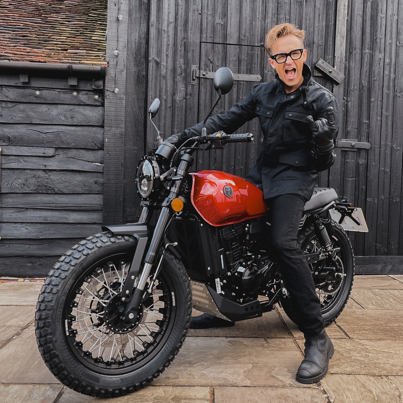 Tom Fletcher or McFly sits atop his brand new DRK-01 in Candy Red