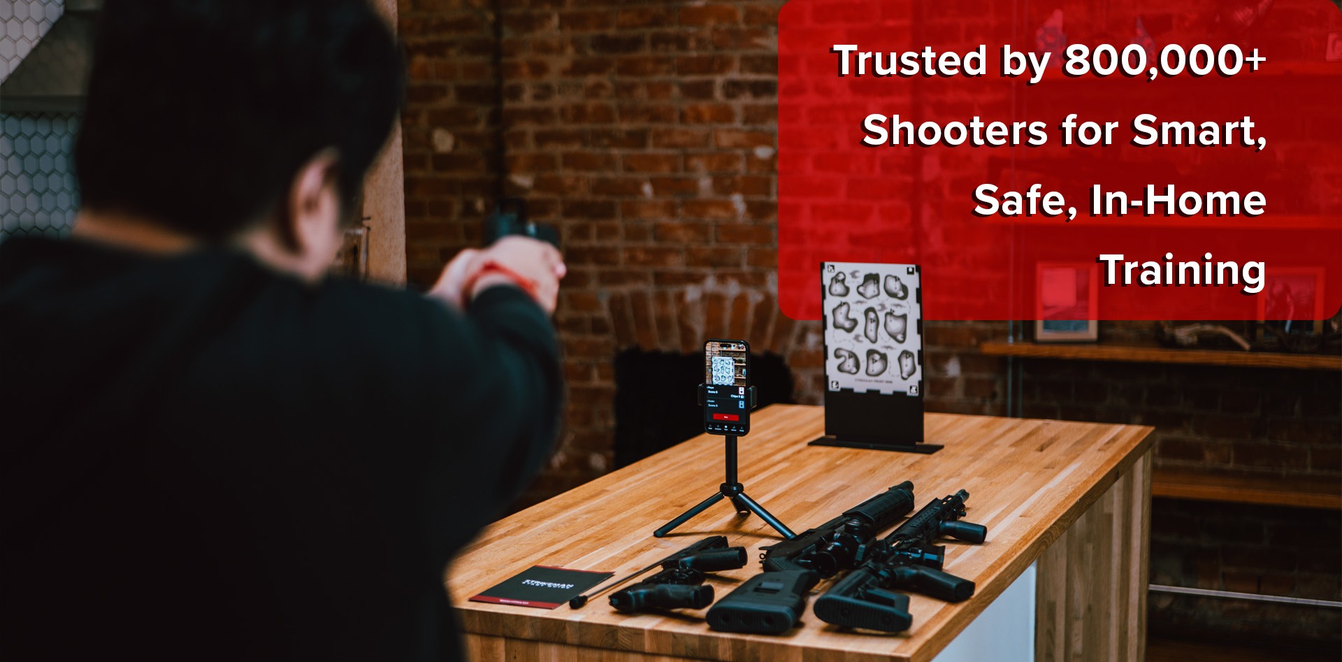 A man aiming a laser at the front 9 target