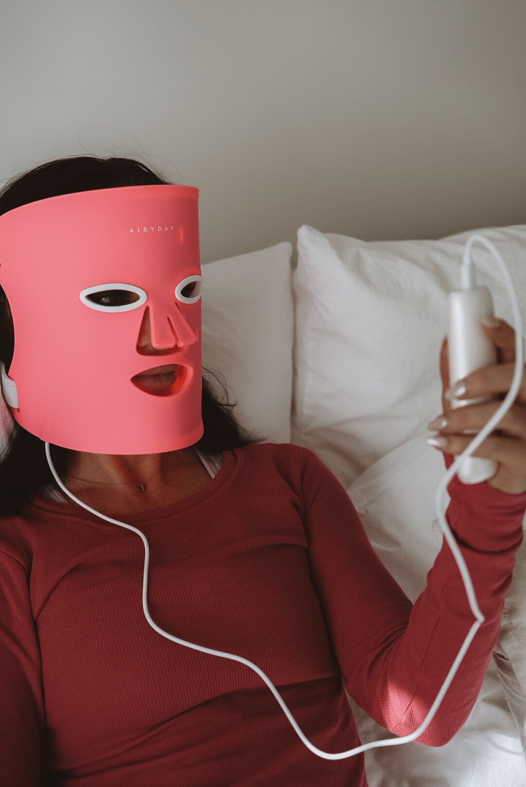 Using an at-home LED mask in bed