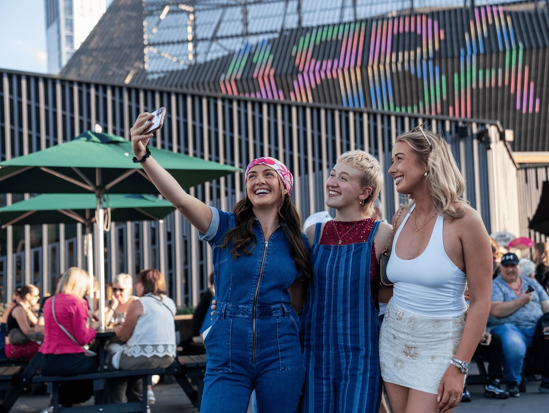 Women posing for a selfie in front of ABBA Arena