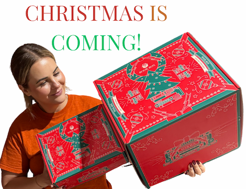Christmas is coming! Kate holding the Christmas Book Box and Bookish Advent Calendar.