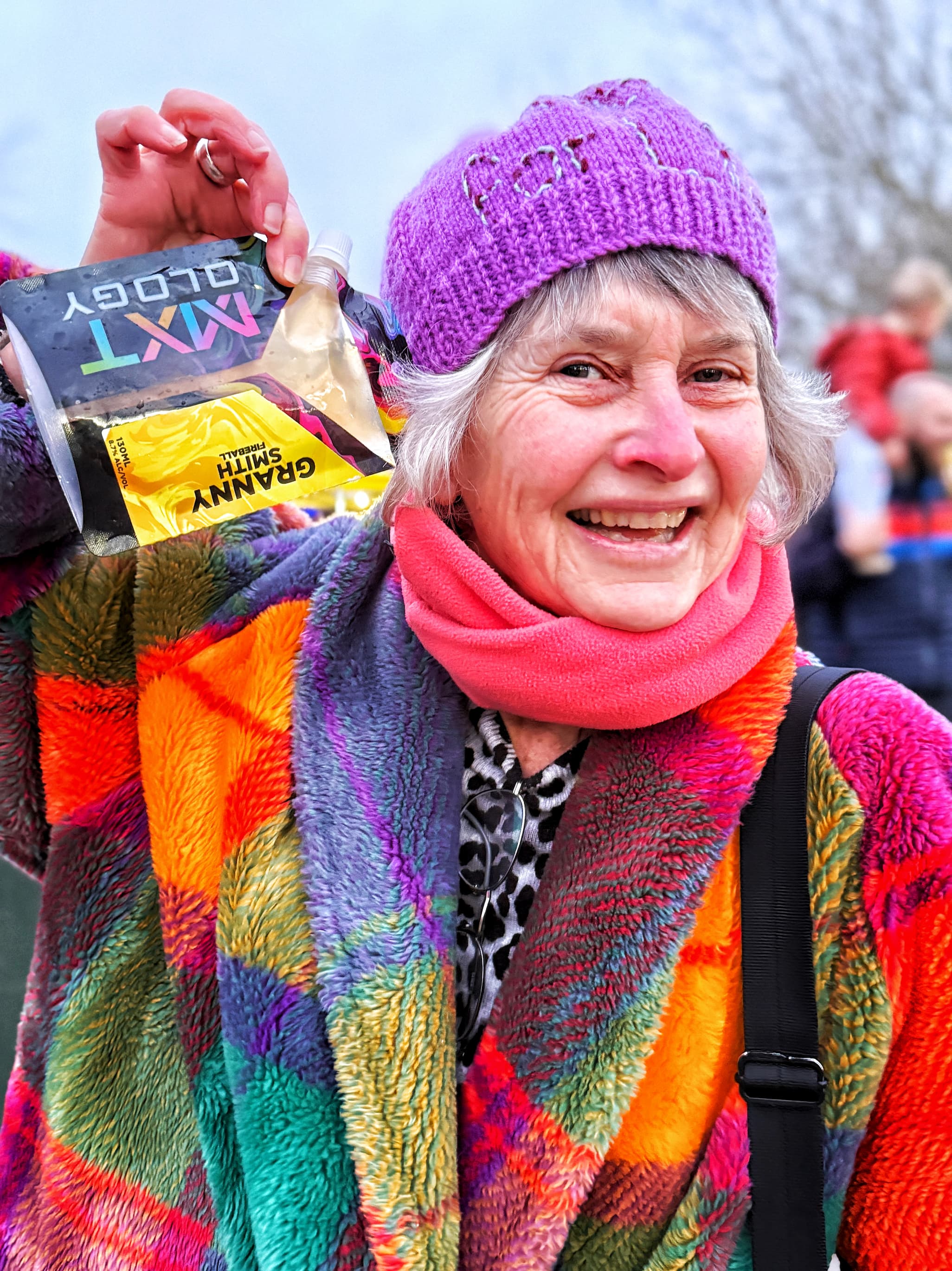 A real customer holding her Granny Smith Fireball