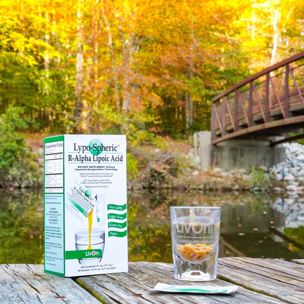 lypo-spheric r-ala carton and shot glass in a fall setting