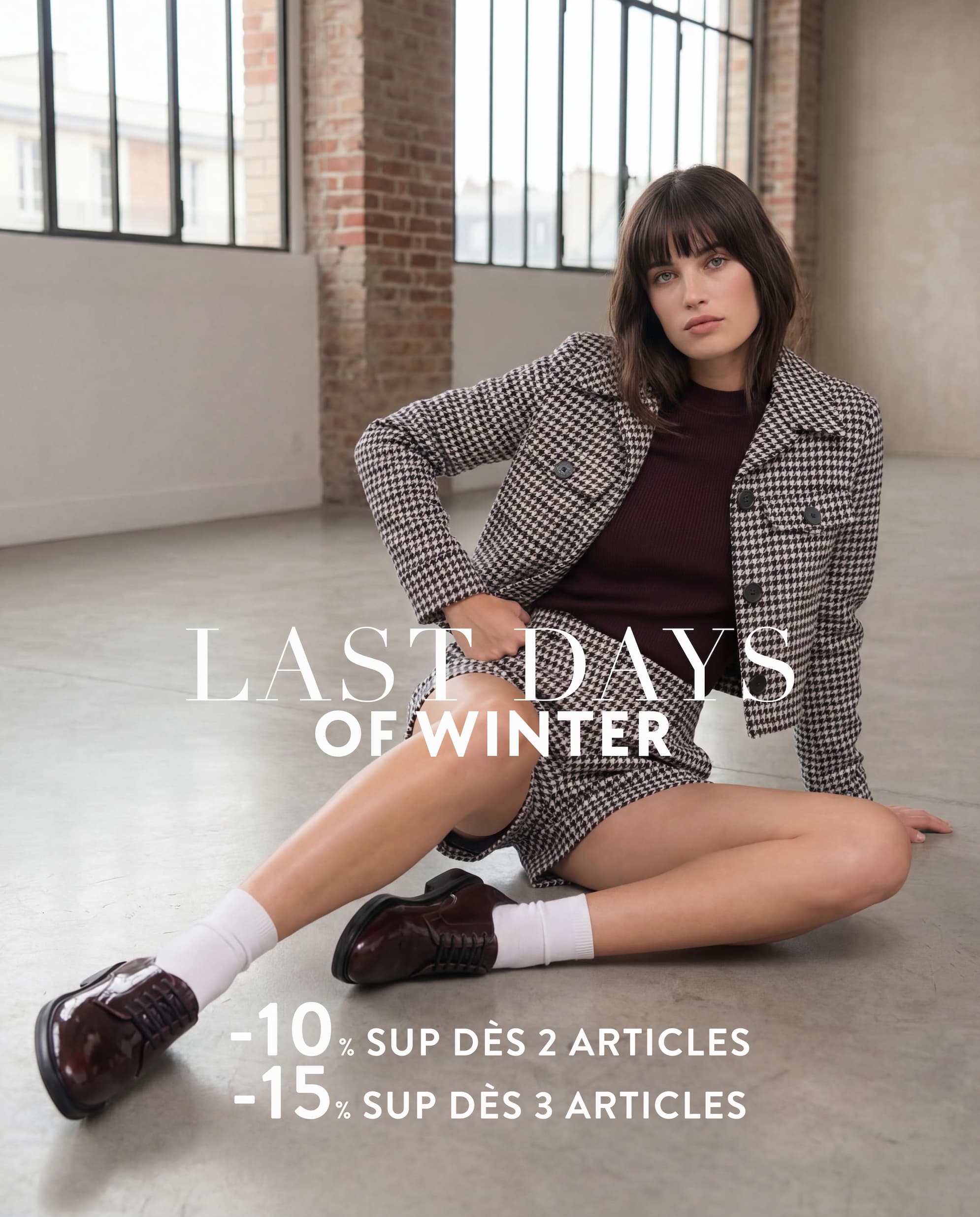 an image of a woman wearing a blue sweater and hat