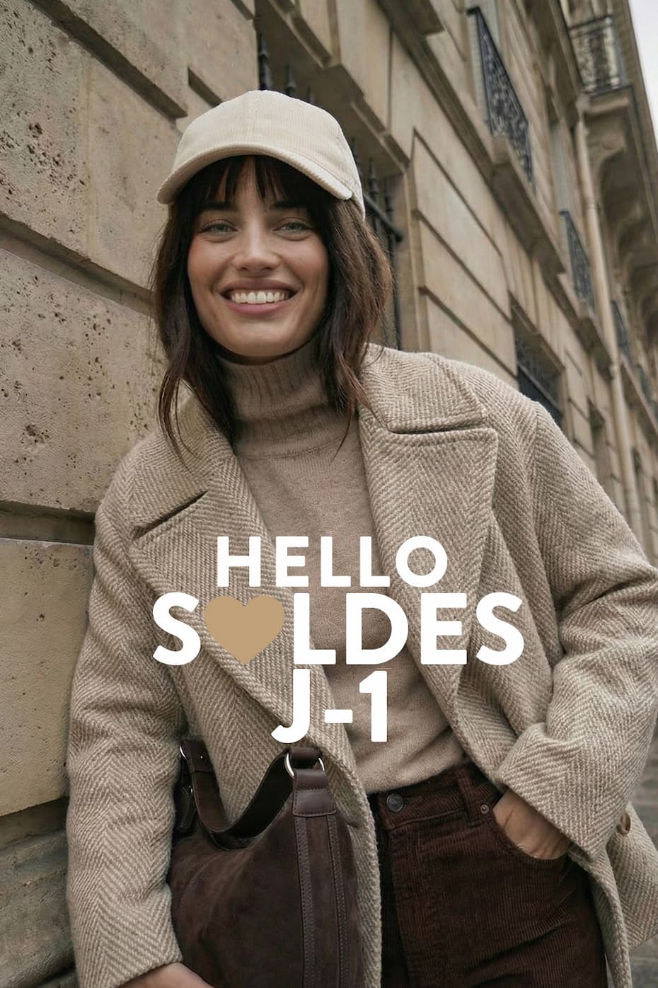 an image of a woman wearing a blue sweater and hat