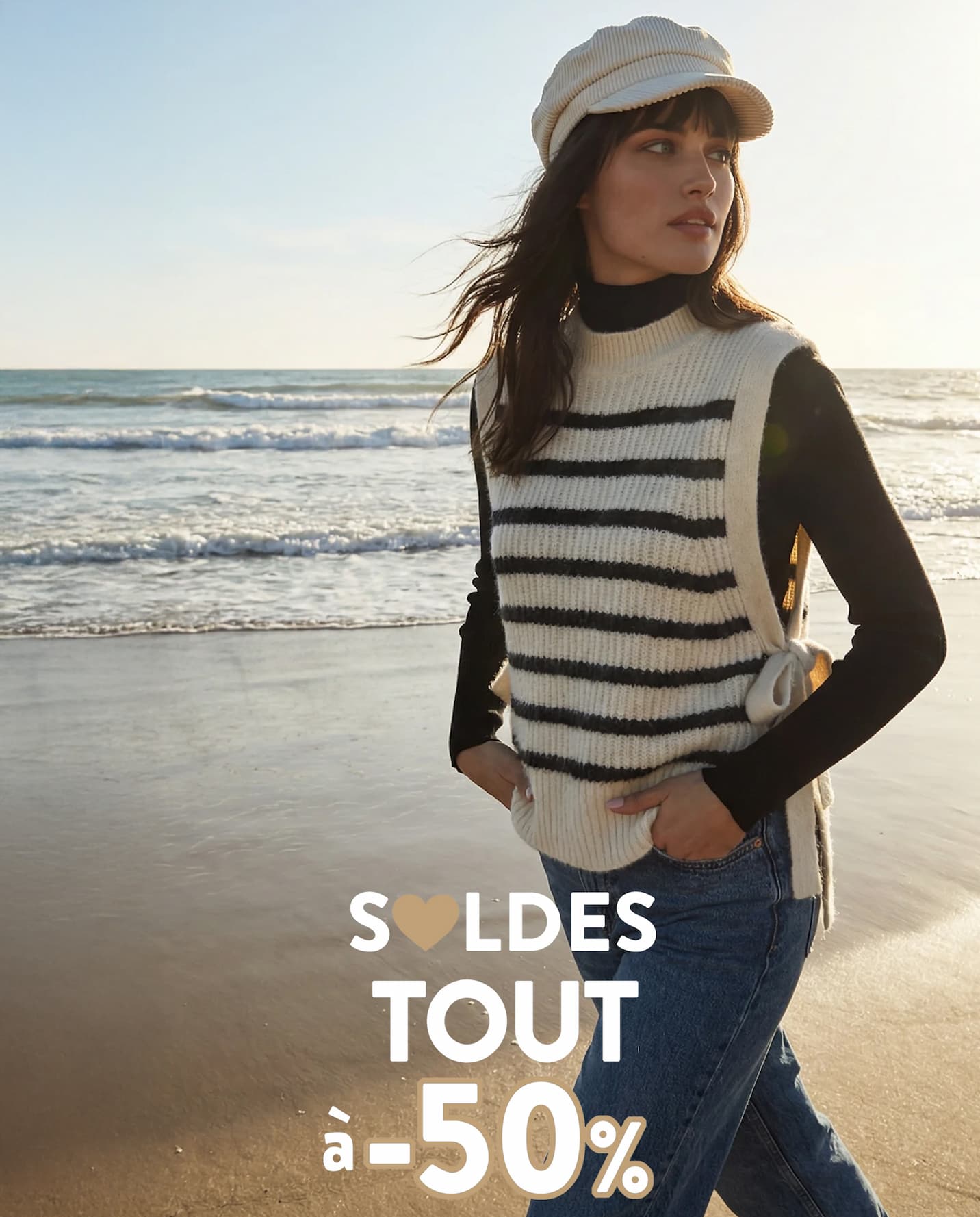 an image of a woman wearing a blue sweater and hat