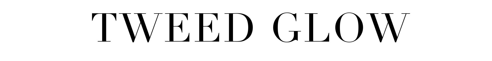 an image of a woman in a dress standing against a wall