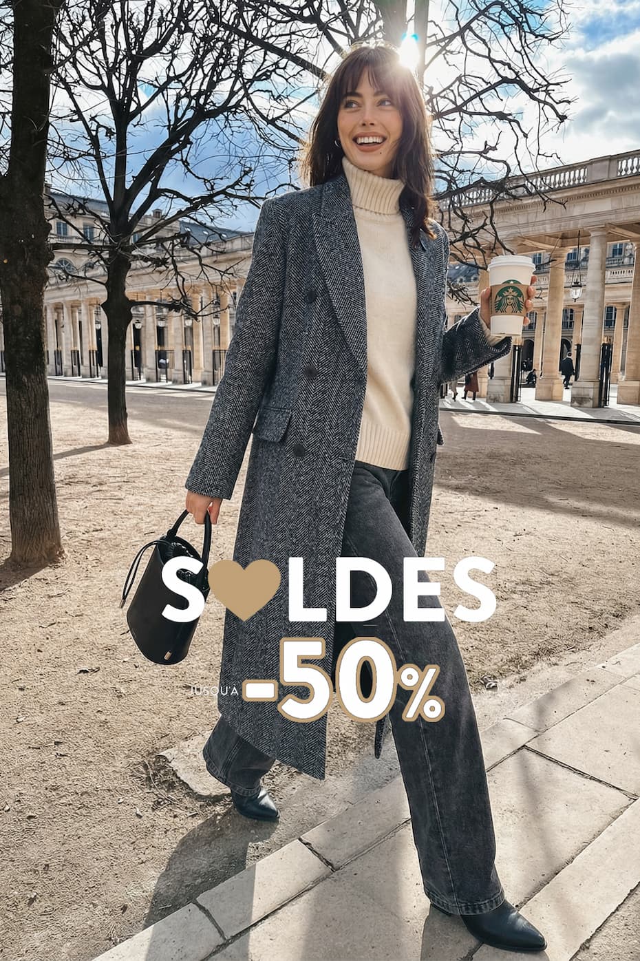 an image of a woman wearing a blue sweater and hat