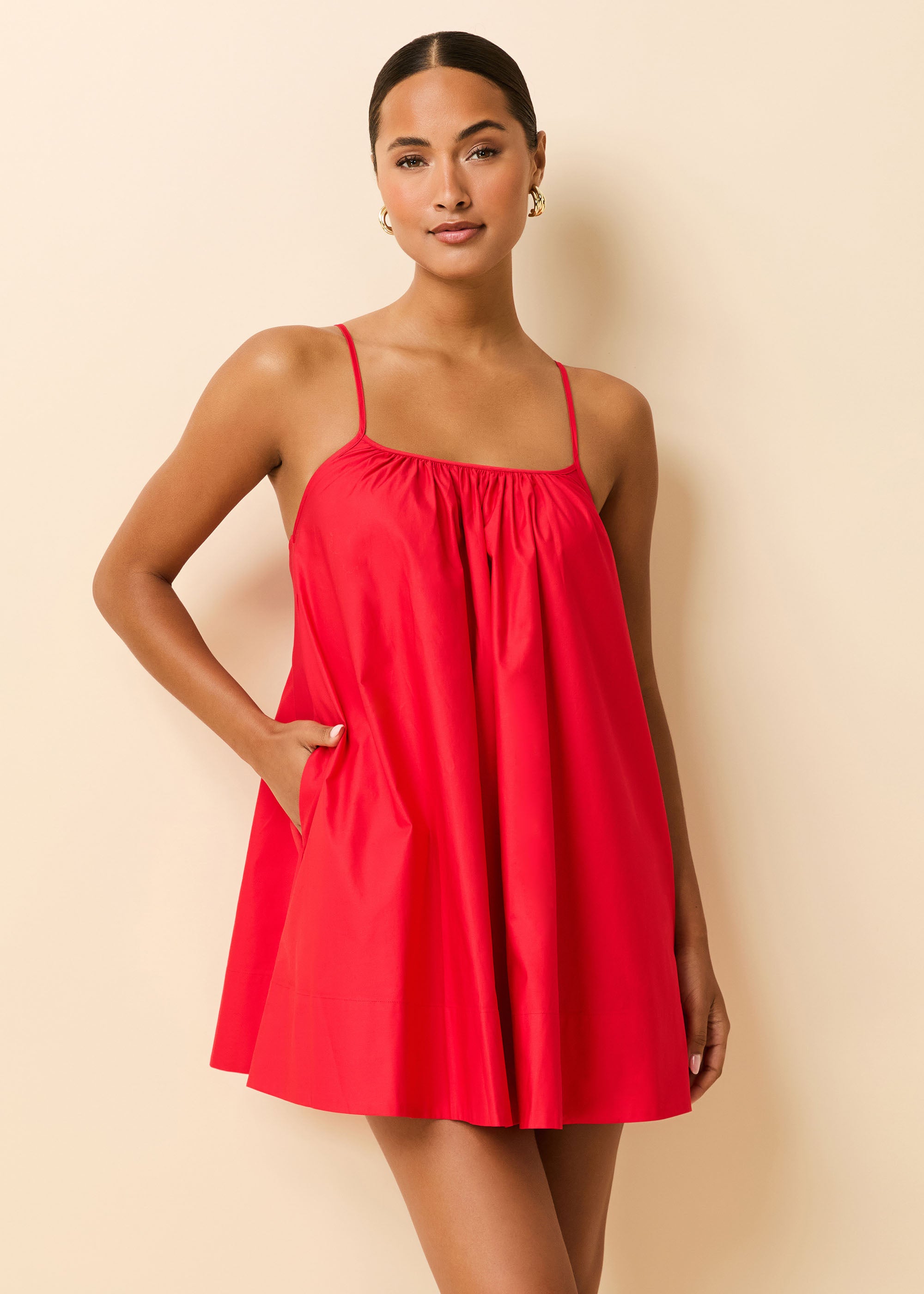 woman in red poplin mini dress