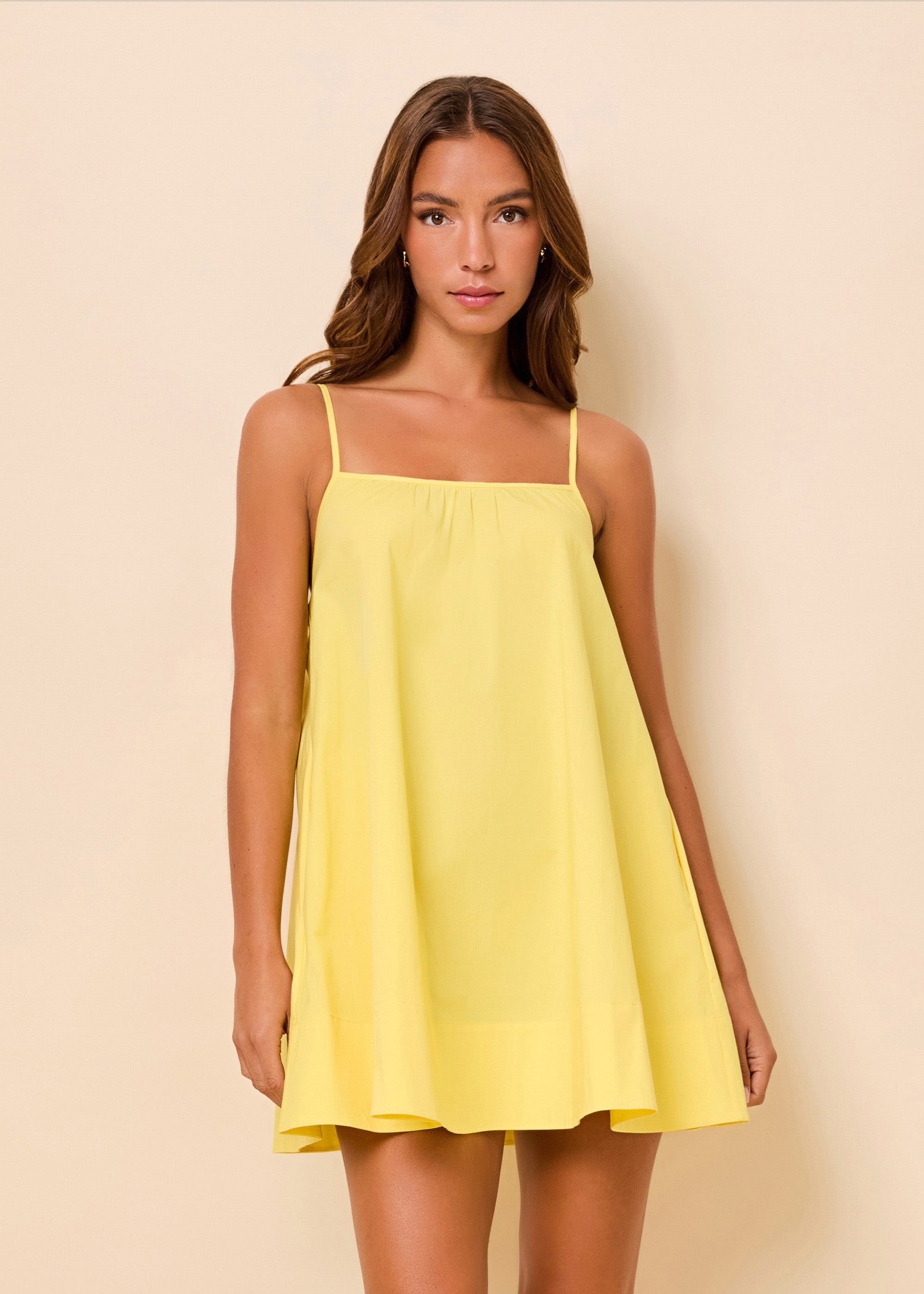 woman in yellow poplin mini dress