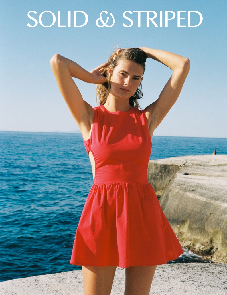 woman in short red dress with side cutouts