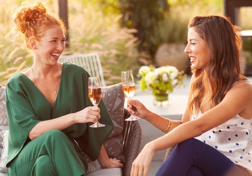 women outdoor enjoying wine