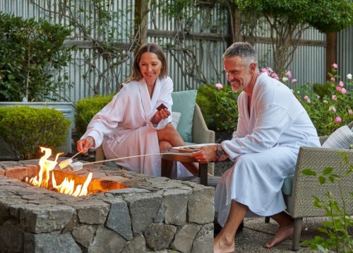 Couple roasting marshmallows outdoor